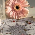 Romantic Getaways - A flower and crystals on a table with a star