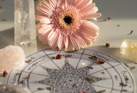 Romantic Getaways - A flower and crystals on a table with a star