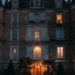 Hotel Discounts - A castle with lights on at night