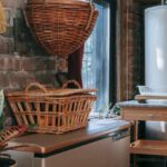 Private Rooms - Interior of kitchen with brick wall decorated with wicker baskets