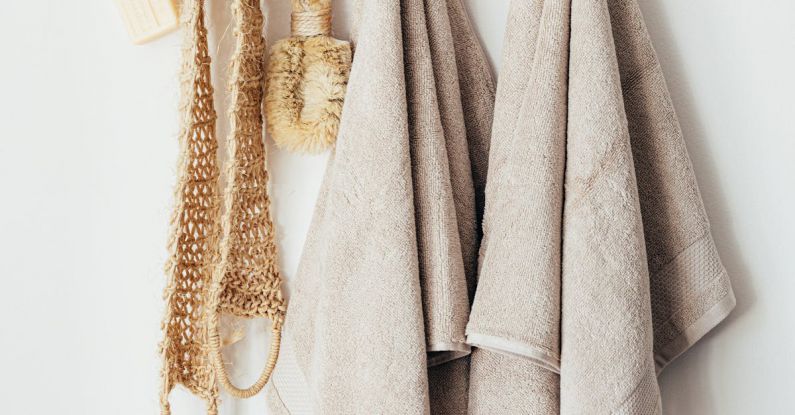 Sustainable Hotels - Set of body care tools with towels on hanger