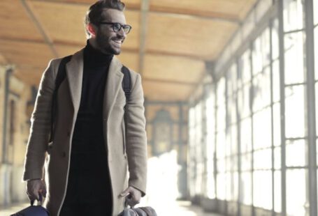 Business Trip - Man in Brown Robe Carrying Bag Smiling