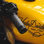 Fast Wi-Fi - A close up of a yellow motorcycle with a black handlebar