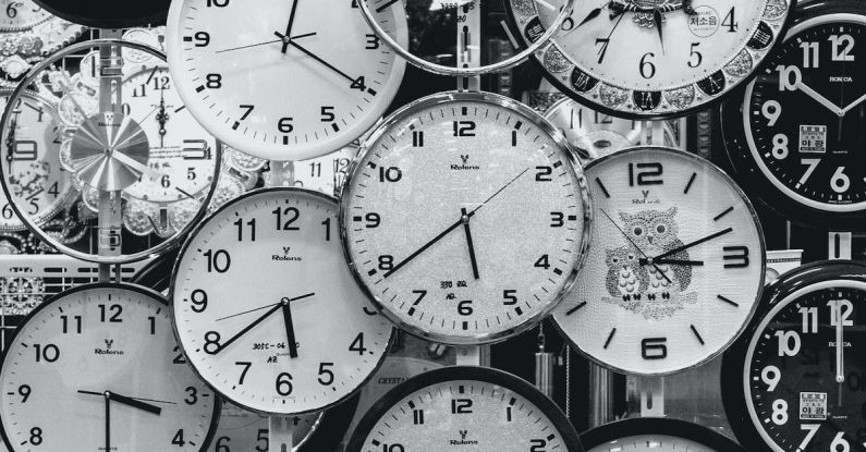Times - Black And White Photo Of Clocks